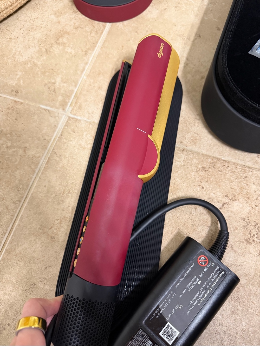 Dyson Airstrait in burgundy and gold